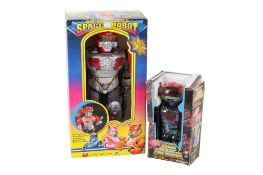 Two vintage toy robots.