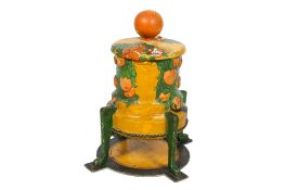 An early 20th century painted wooden four legged storage container with cover.