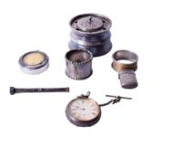 A group of assorted silver and white metal items.