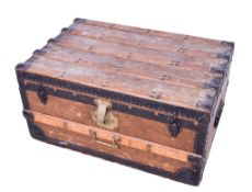 A vintage wooden framed trunk.