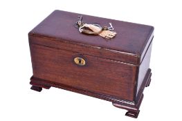A mahogany tea caddy.