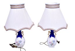 A pair of Limoges ceramic lamp bases with shades.