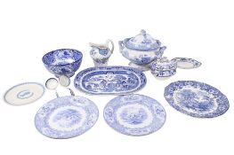 A group of assorted blue and white transfer printed ceramics.