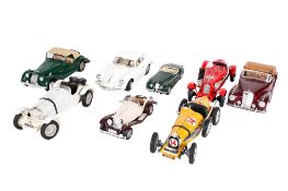 A collection of eight assorted modern diecast models of vintage cars.