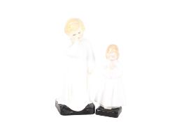 Two Royal Doulton figures of children. Comprising 'Darling' HN 1319 and 'Bedtime' HN 1978. Max.