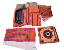 A collection of assorted ethnic fabrics.