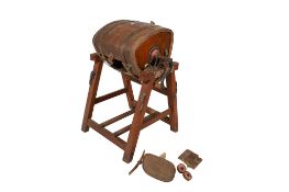 A vintage Llewellin & Son wooden butter churn on stand.