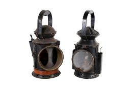 Two vintage oil lanterns.
