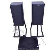A pair of Sony freestanding speakers and a Cambridge Audio amp.