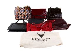 A group of seven vintage women's fashion handbags.