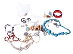A small group of costume jewellery. Including colourful necklaces, bangles, brooches, etc.