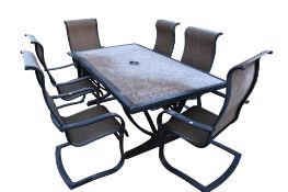 A garden table and set of six chairs.