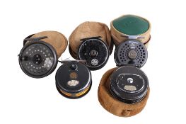 Five assorted vintage fly fishing reels.