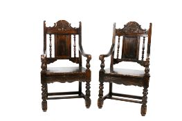 A pair of 19th century panel back open armchairs.