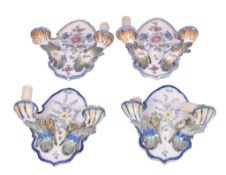 Two pairs of faience Portuguese ceramic wall sconces.