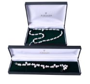 A matching cultured pearl necklace and bracelet.