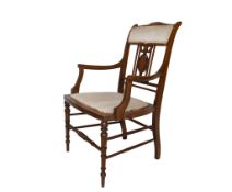 An Edwardian inlaid mahogany bedroom armchair.