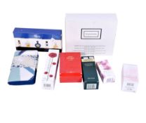 A collection of perfumes and vanity items. Including a No.