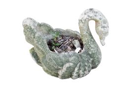 A reconstituted stone garden pot in the form of a swan. H54cm.