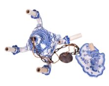 A Portuguese ceramic wall sconce and a four branch chandelier.