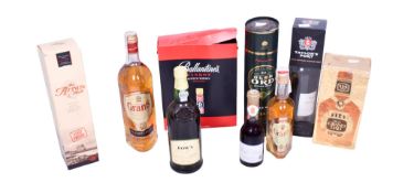 A collection of ten bottles of assorted alcohol.