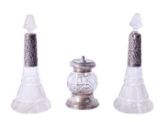 Three silver mounted items including a pair of cut glass scent bottles.