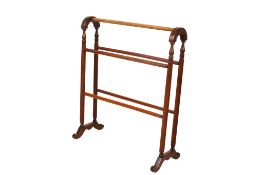 An Edwardian mahogany bathroom towel rail.