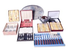 A small group of lead crystal glasses and silverplated cutlery.