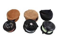 Two fly fishing reels and a spare spool.