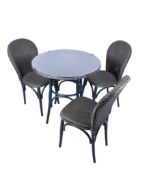 A Lloyd Loom four-piece table and chairs set.