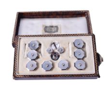 A set of silver and enamel dress studs and cufflinks. Marked silver and OP, gross weight 11.