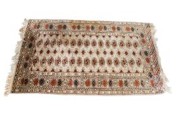 A small Bokhara style wool rug.