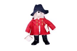 A vintage plush model of Paddington Bear.
