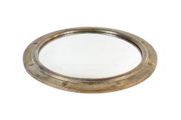 A circular convex brass framed wall mirror.