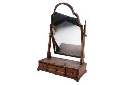 A Queen Anne style mahogany dress swing mirror with brass finials.