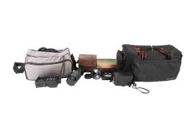 An assortment of cameras, lenses and photographica. Including a Kiron 70-210mm f/4.