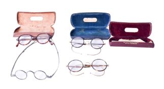 A group of four assorted vintage spectacles.