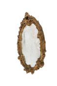 A mid-century gilt framed oval wall mirror. Having swags and floral decoration.