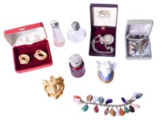 A collection of vintage scent bottles and costume jewellery.