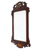 A Georgian style gilt mahogany fret work wall mirror.