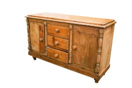 An antique pine sideboard.