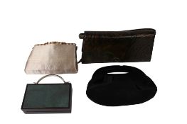 Four designer and cultural handbags.