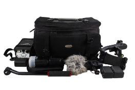 A large camera bag and accessories (video?).