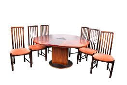 A mid-century Danish Skovby M33 extending circular dining table and six chairs, Chair H102cm.