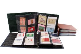 Four ring binders containing vintage cigarette packets.