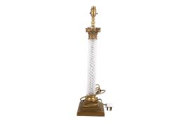 A contemporary brass and glass Corinthian column table lamp. Raised on a stepped square base.