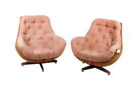 A pair of circa 1970s swivel lounge 'egg' chairs.