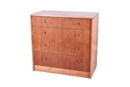A mid-century pine and teak chest of drawers.