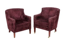 A pair of vintage tub chairs.