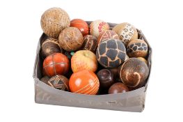 A collection of decorative wooden balls and stone eggs. Various sizes and patterns.
